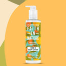 Faith In Nature Vegan Hand & Body Lotion - Grapefruit & Orange on a yellow, beige and green background.
