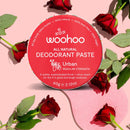 Woohoo URBAN deodorant paste tin surrounded by roses to highlight the with its subtle floral scent made using a beautiful blend of 100% natural essential oils (sage, rose, vanilla, orange & lavender)