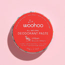 Award winning Woohoo URBAN Natural Deodorant Paste tin on a pink background. Itworks all day - NO Body odour & NO irritation.