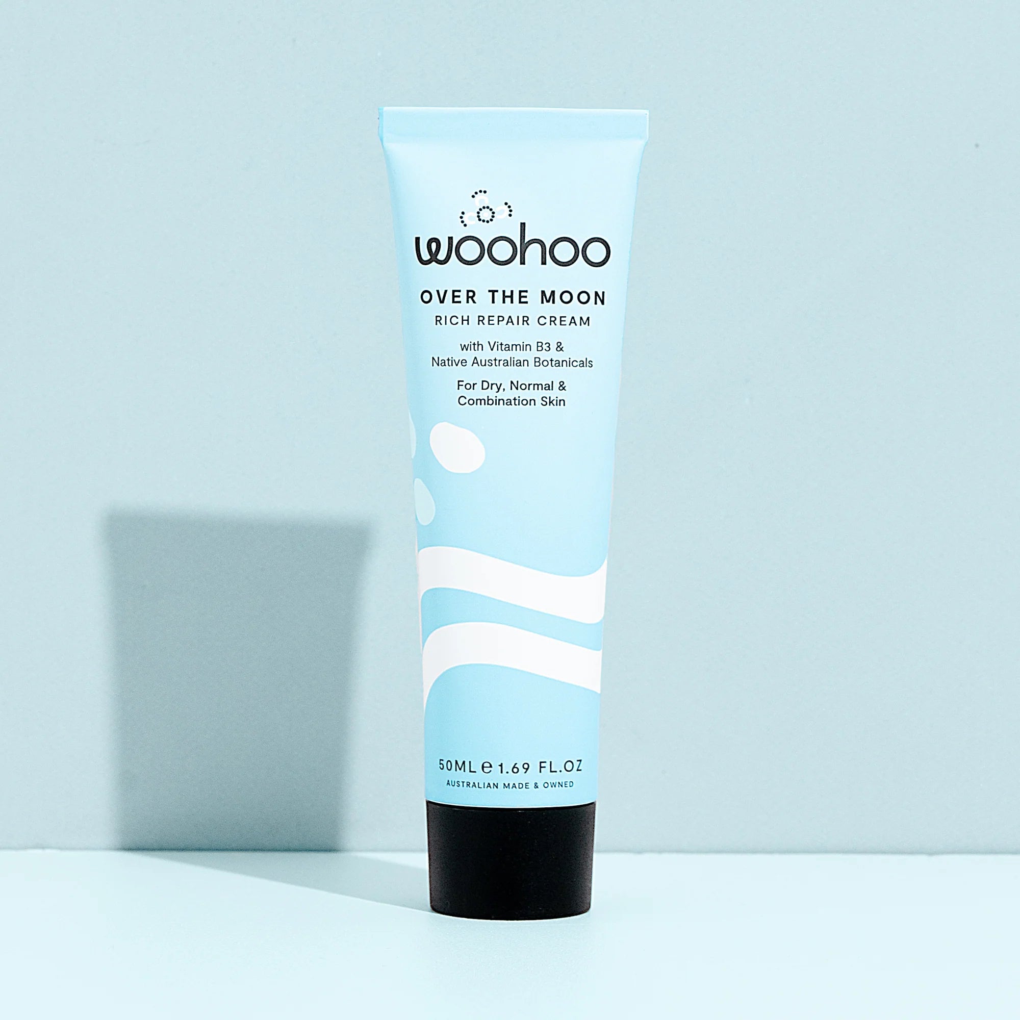 Image of the Woohoo Over The Moon Rich Repair Cream tube on a light blue background