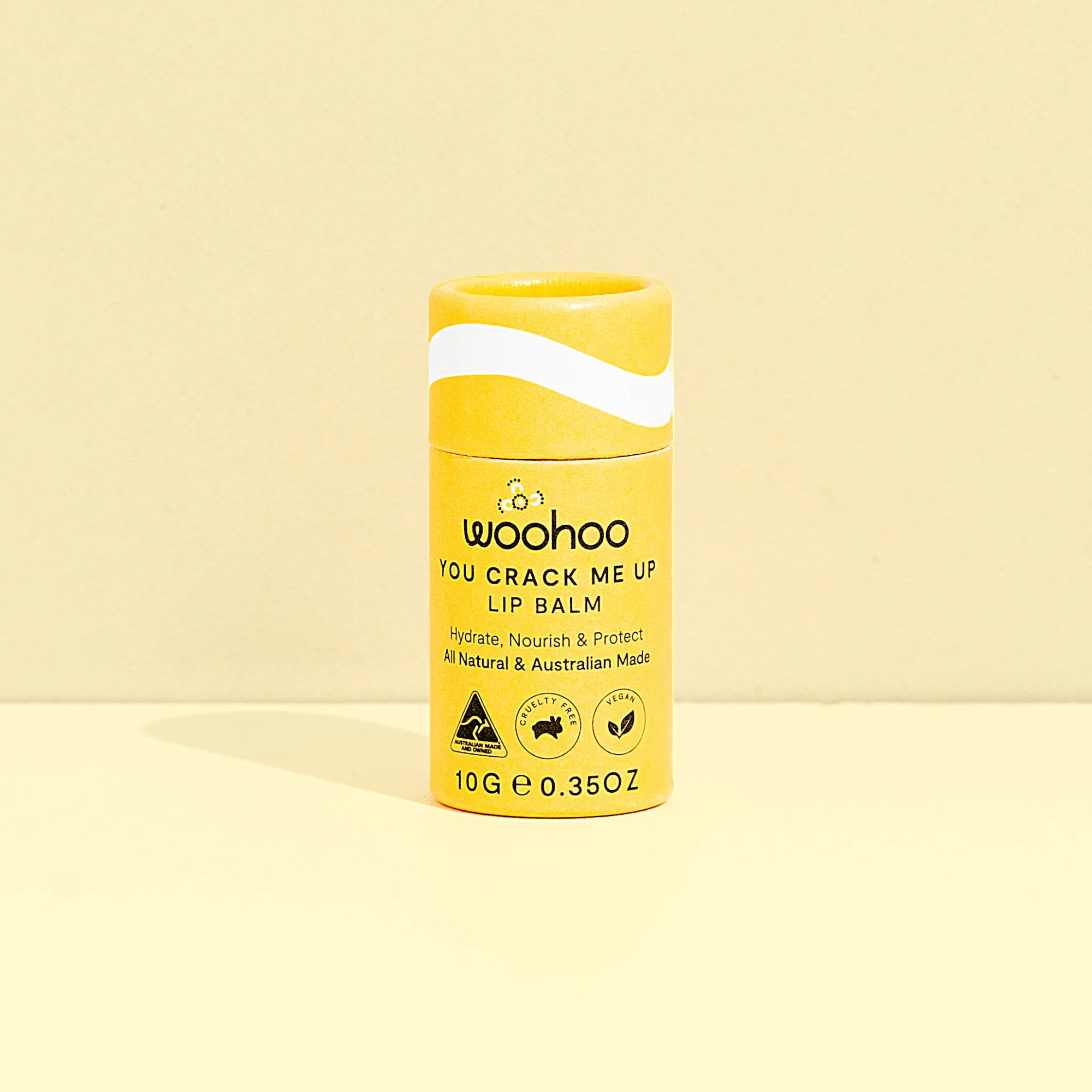 Image of the Woohoo You Crack Me Up! Lip Balm on a light yellow background 