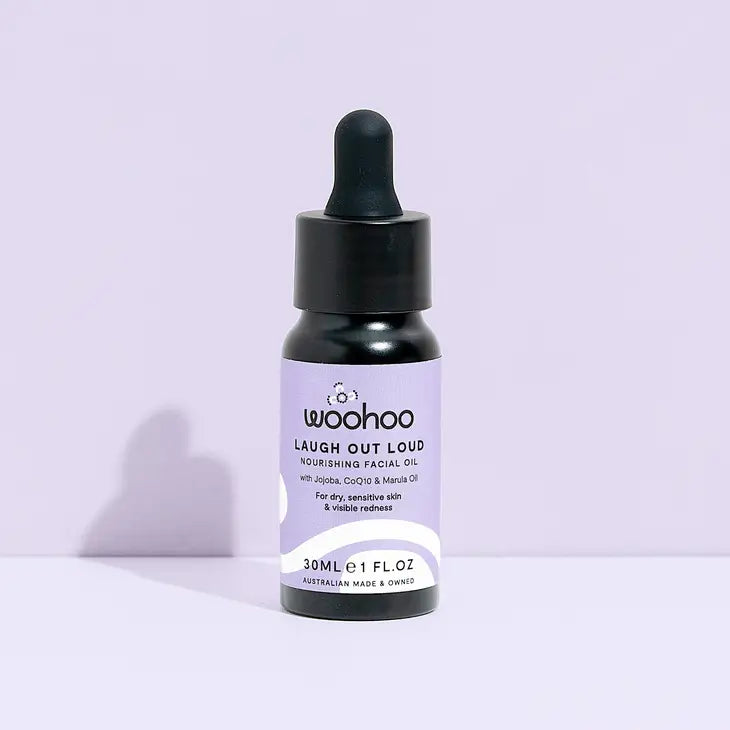 Image of the Woohoo Laugh Out Loud Nourishing Facial Oil bottle with dropper on a light purple background