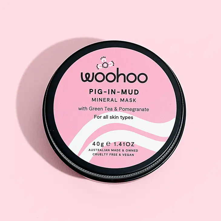 Image of the Woohoo Pig-In-Mud Mineral Mask tin on a pink background 