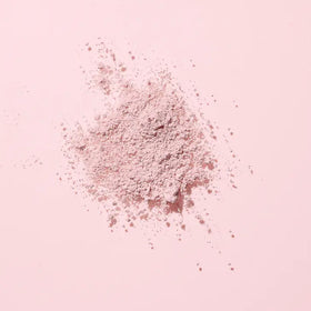 Image of the Woohoo Pig-In-Mud Mineral Mask powder on a pink background 