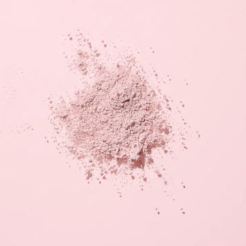 Image of the Woohoo Pig-In-Mud Mineral Mask powder on a pink background 